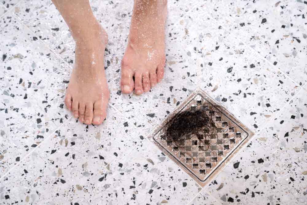 clumps of hair in bathroom drain