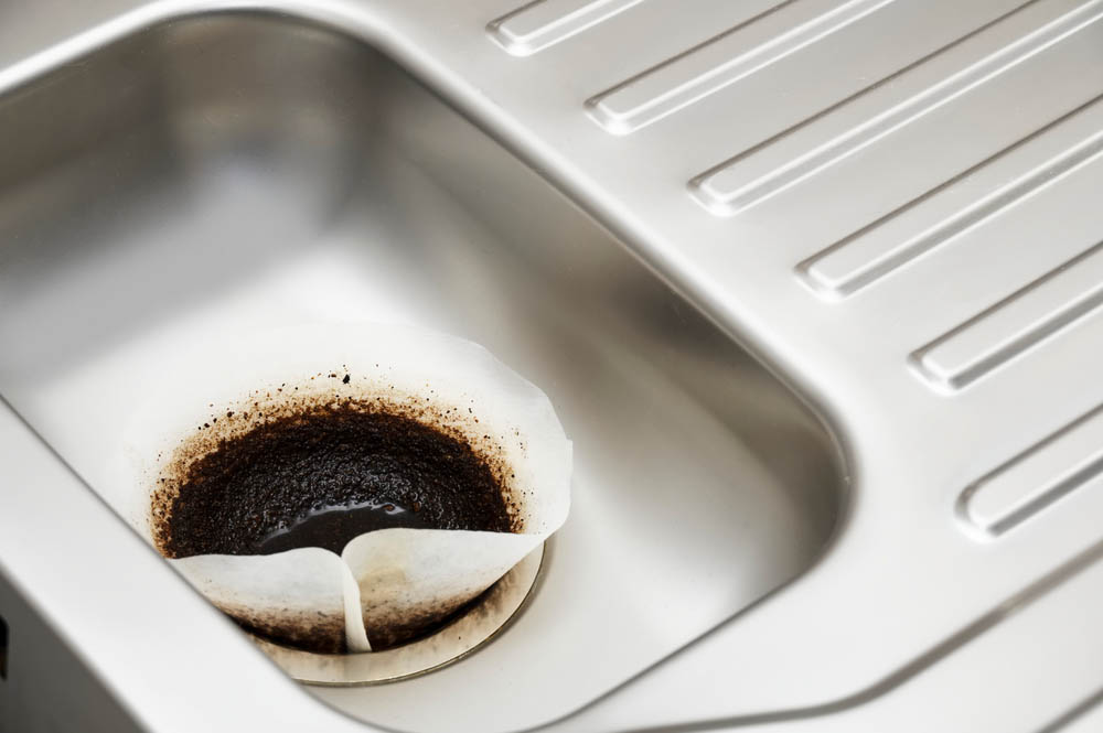 coffee grounds on kitchen drain