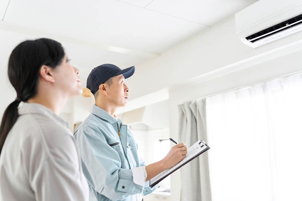 HVAC technician inspecting a home HVAC technician inspecting a home
