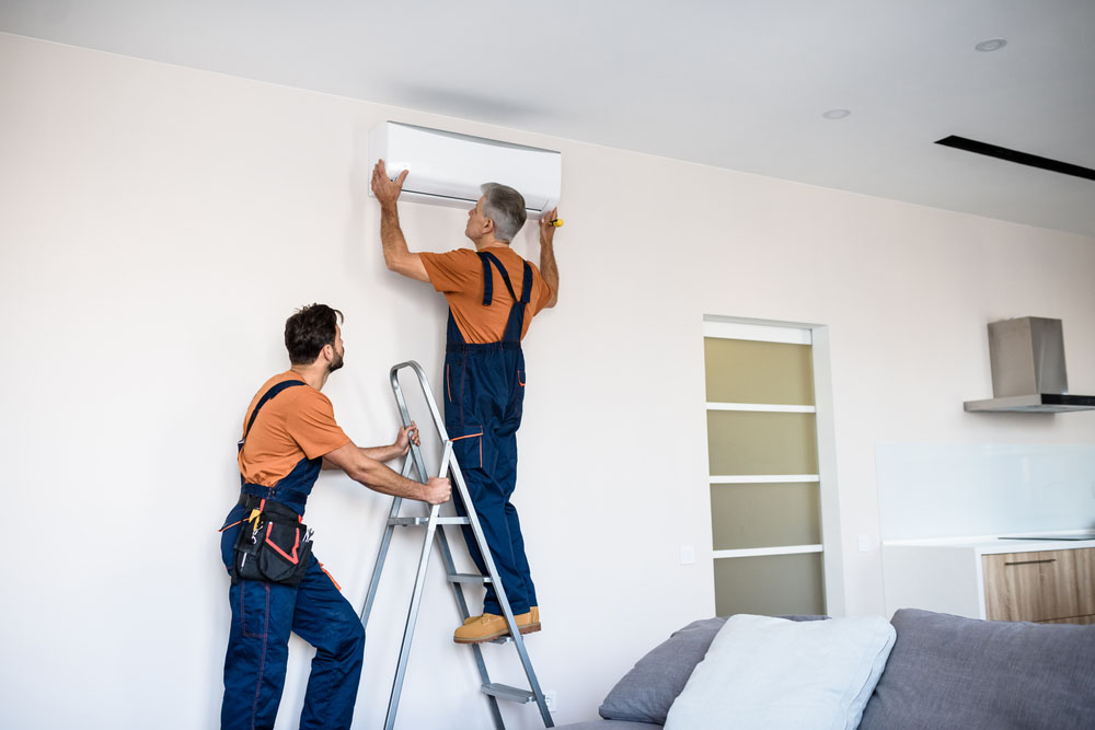 C. Lee technician installing a new AC system