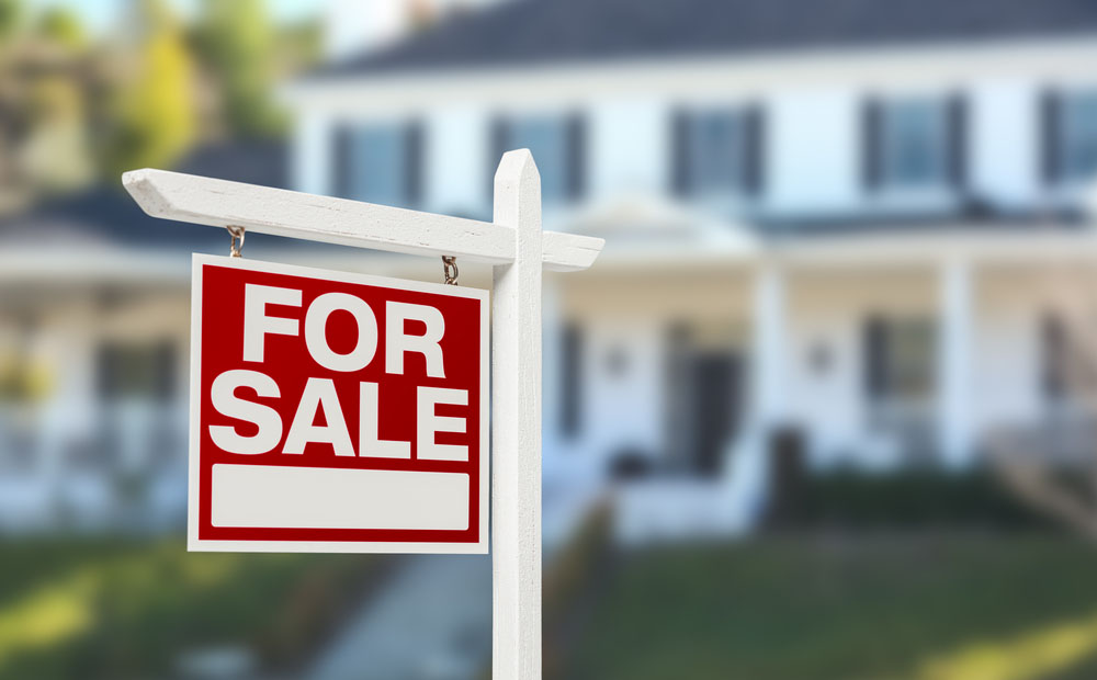 property with a ‘for sale’ sign property with a ‘for sale’ sign