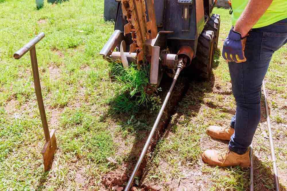C. Lee technician working on trenchless repairs