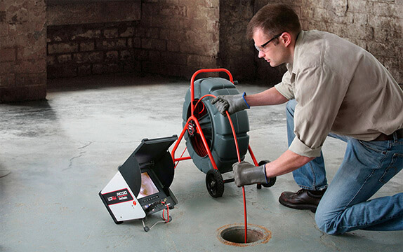 C. Lee Services performing sewer camera inspection