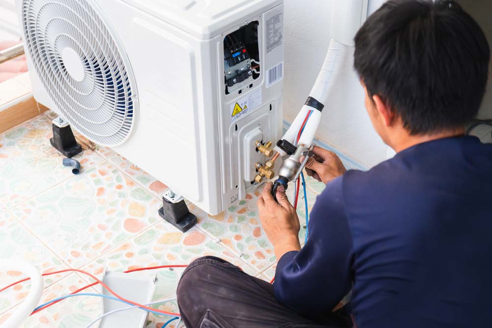 technicians installing a new HVAC unit
