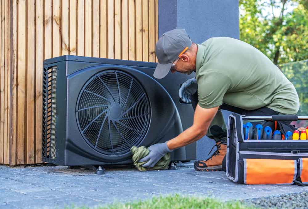 C. Lee Services technician installing an HVAC unit