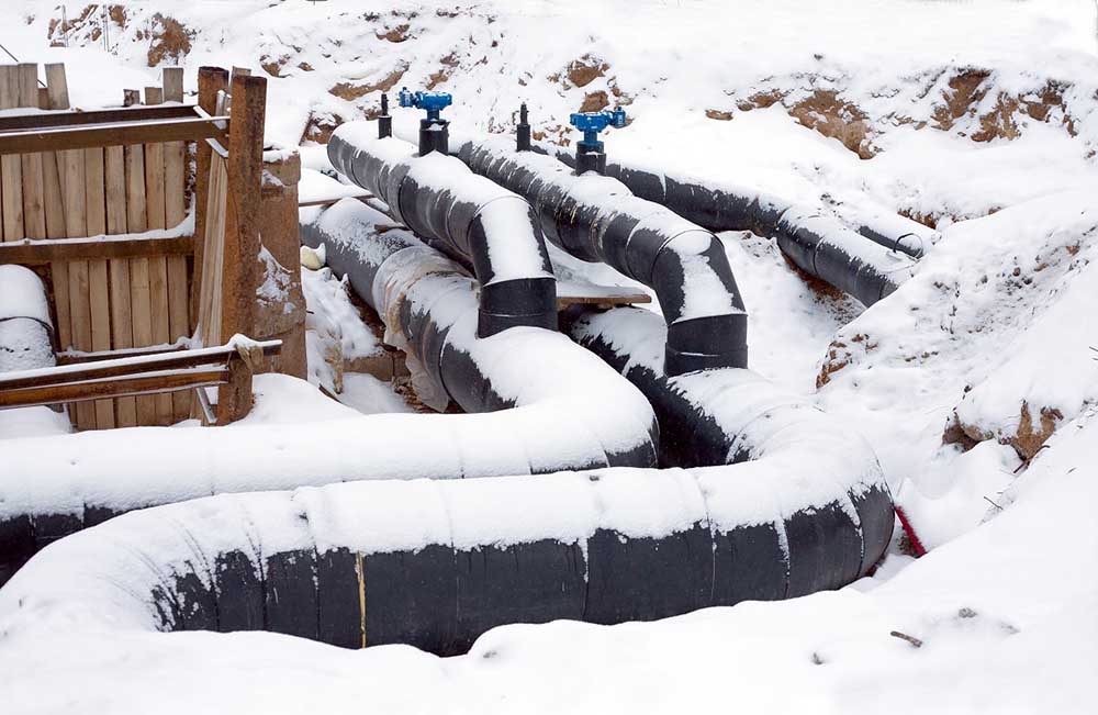 pipes partially covered in snow or frost