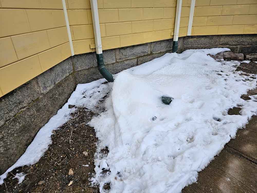 snow-covered exterior drains