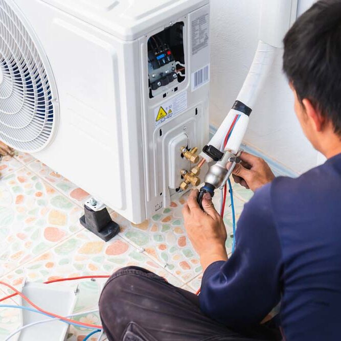 Air conditioning technicians install new air conditioner in homes, Repairman fix air conditioning systems, Male technician service for repair and maintenance of air conditioners