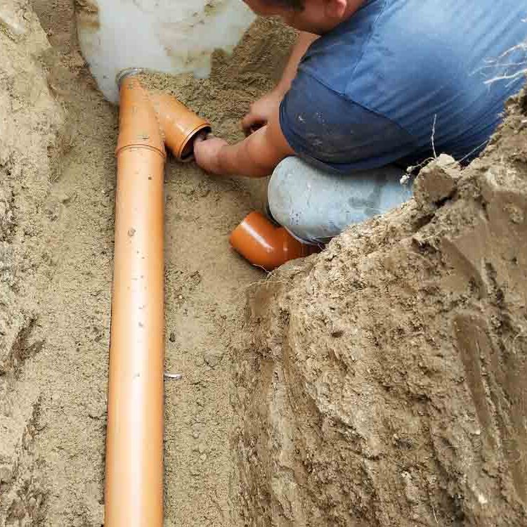Supply,Of,A,Sewer,Pipe,To,A,Sump,By,A Supply of a sewer pipe to a sump by a master locksmith in the countryside.